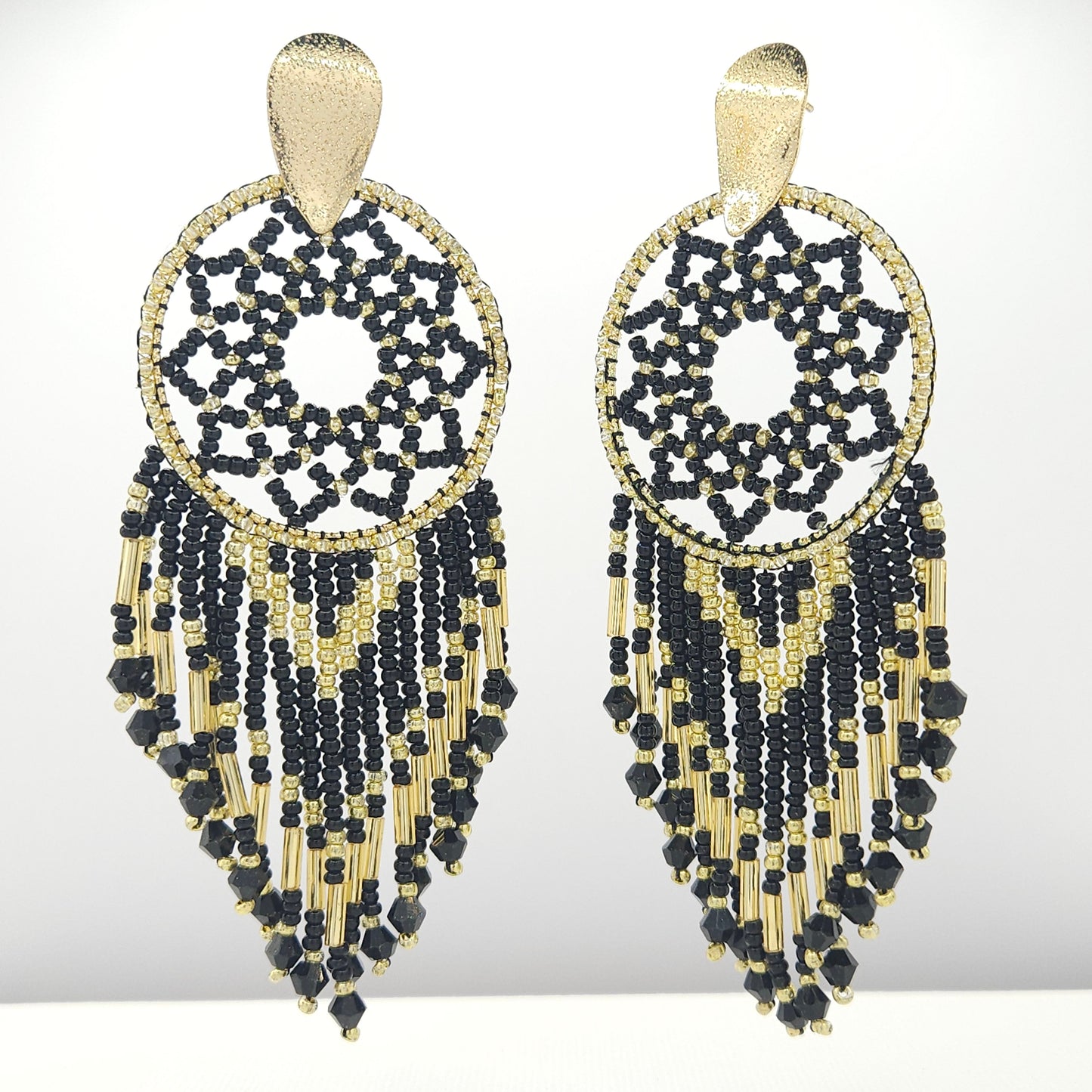 Handmade statement artisanal earrings made of Czech beads and Metal coated in a goldtone finish