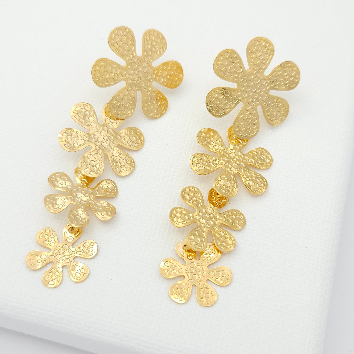 Handmade 18k gold plated bronze statement earrings featuring a graceful cascade of blossoming flowers