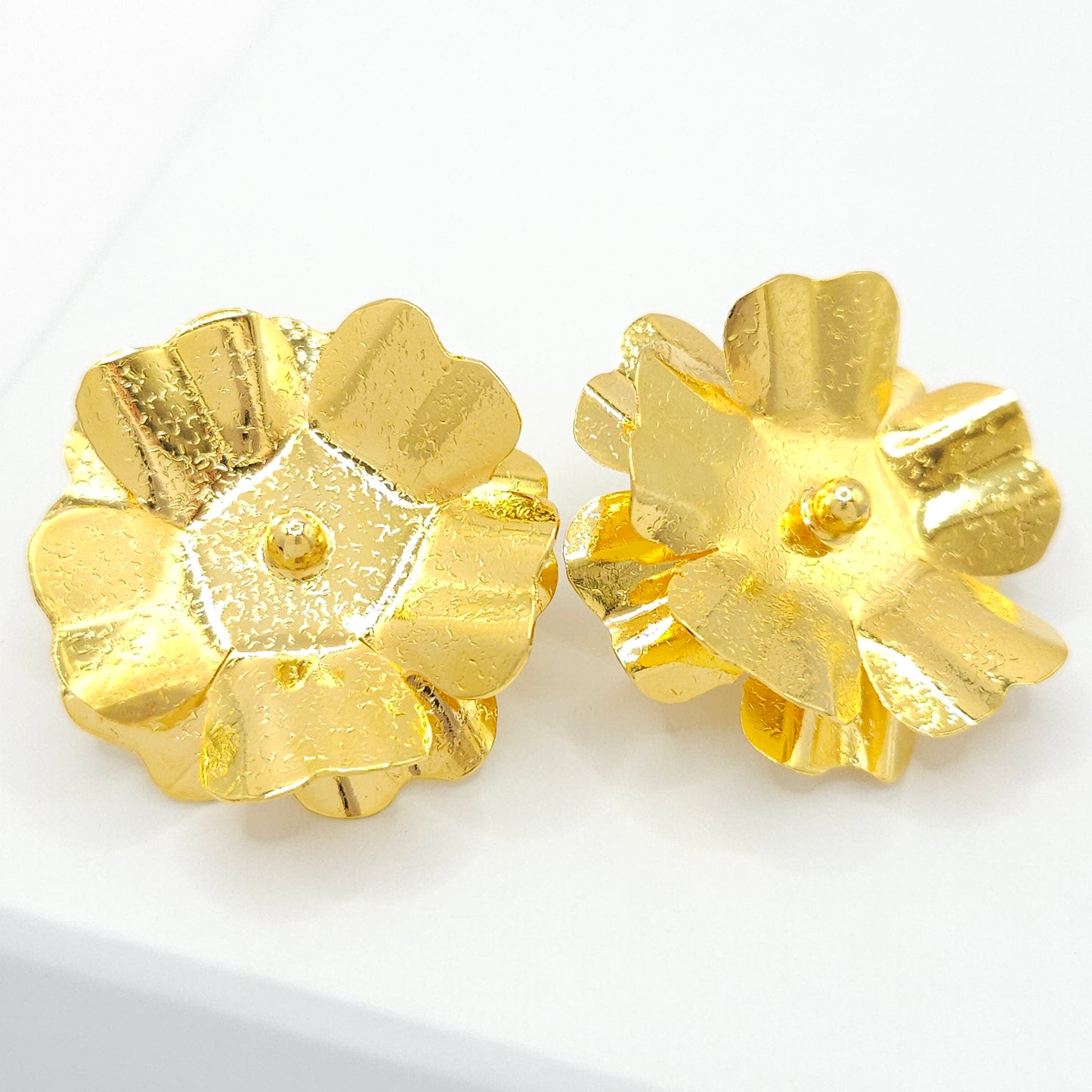 Large stud earrings with a double layer flower design crafted from 18k gold-plated bronze