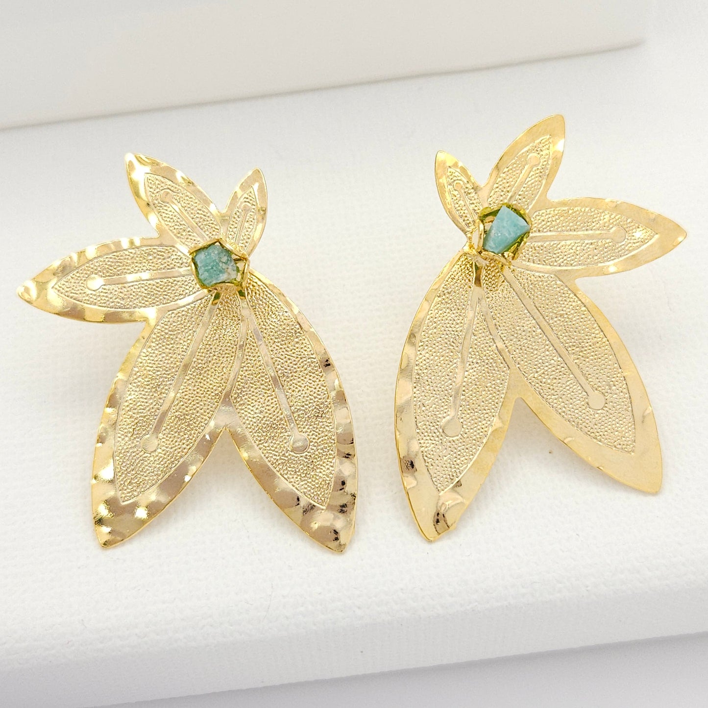 Handmade half-leaf statement earrings from luxurious 18k gold-plated bronze and Emerald murralla