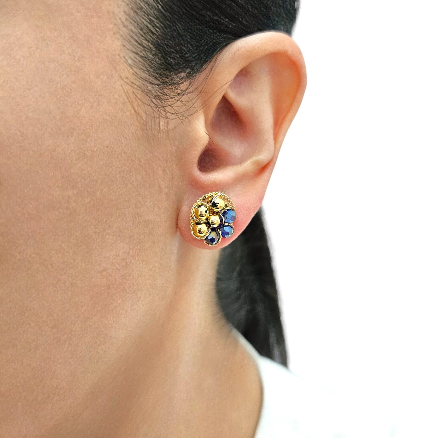 Flower-shaped stud earrings with goldtone spheres and blue Murano glass