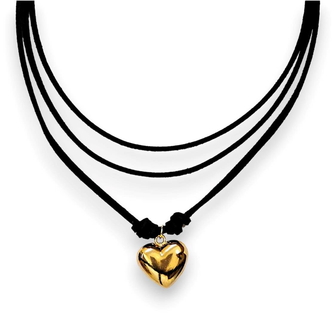 Handmade leather corded necklace suspending a puffed heart pendant
