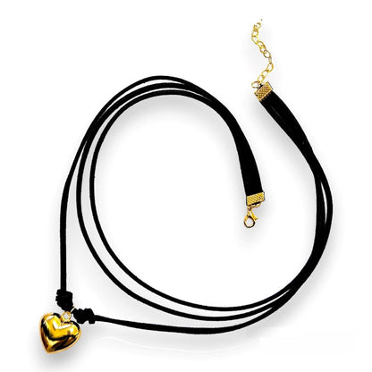 Handmade leather corded necklace suspending a puffed heart pendant